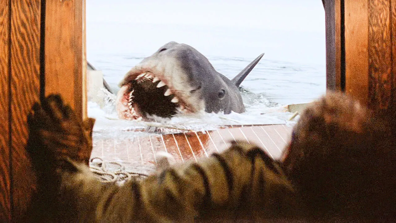 The shark bursting through the transom of the Orca, mouth open, in Jaws (1975)