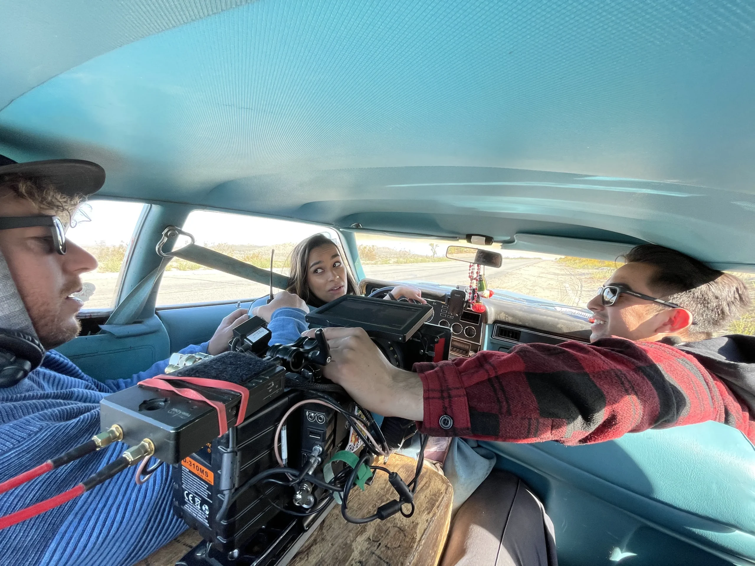 A RED Gemini camera rig crammed into the picture car with the actress driving, on a Blood Star desert road