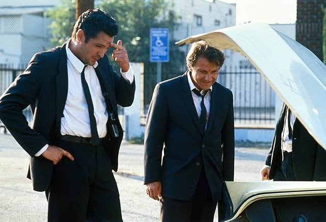 The Reservoir Dogs crew gathered around a diner table during the film's opening breakfast scene