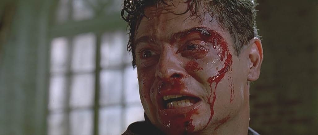 Mr Orange, bloodied and in visible pain, in one of Reservoir Dogs' warehouse scenes