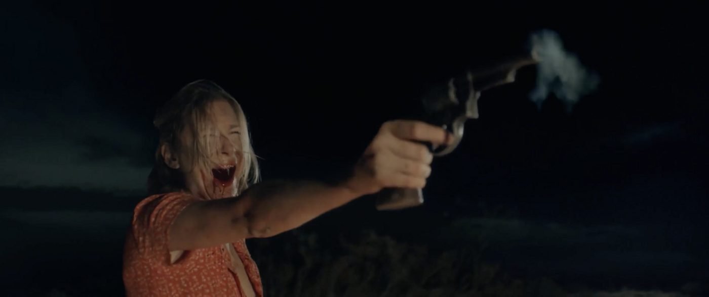 The cold-open victim firing the revolver in Blood Star, blood on her face, a real shot rather than a trick