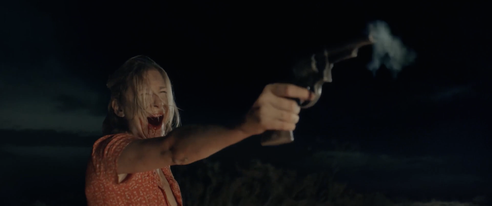 The cold-open victim firing the revolver in Blood Star, blood on her face, a real shot rather than a trick