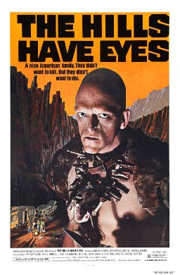 Theatrical poster for The Hills Have Eyes (1977), showing the mutant Pluto against a desert canyon backdrop
