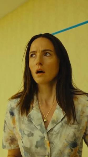 Mary, alarmed, in a yellow-walled Backrooms corridor