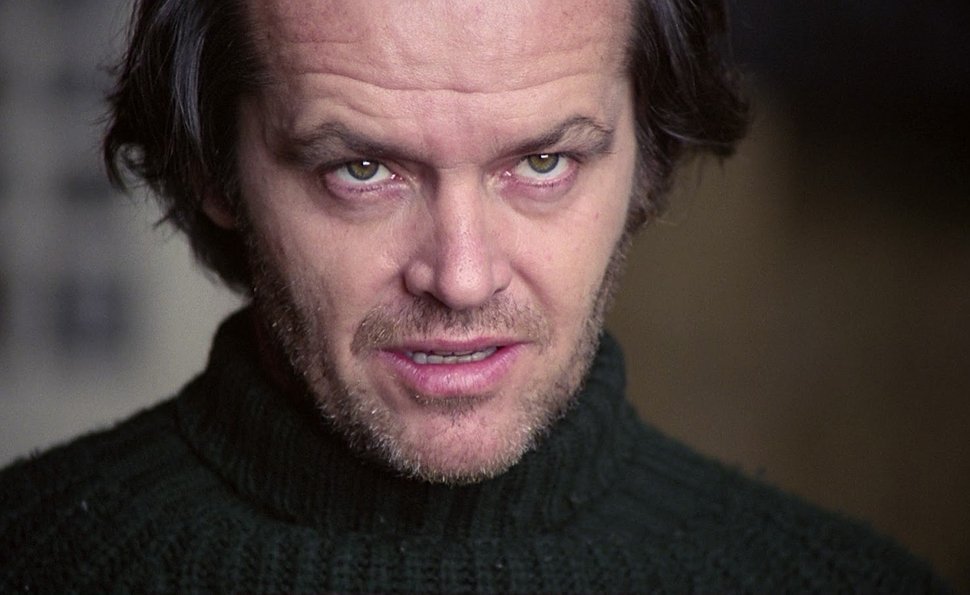 A close-up of Jack Torrance, still outwardly composed but visibly unraveling