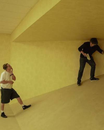 A screenshot from Kane Parsons' original low-budget viral Backrooms short film, showing an impossible slanted room angle