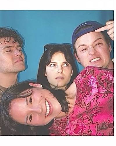 The film's young cast in a playful photobooth-style group portrait