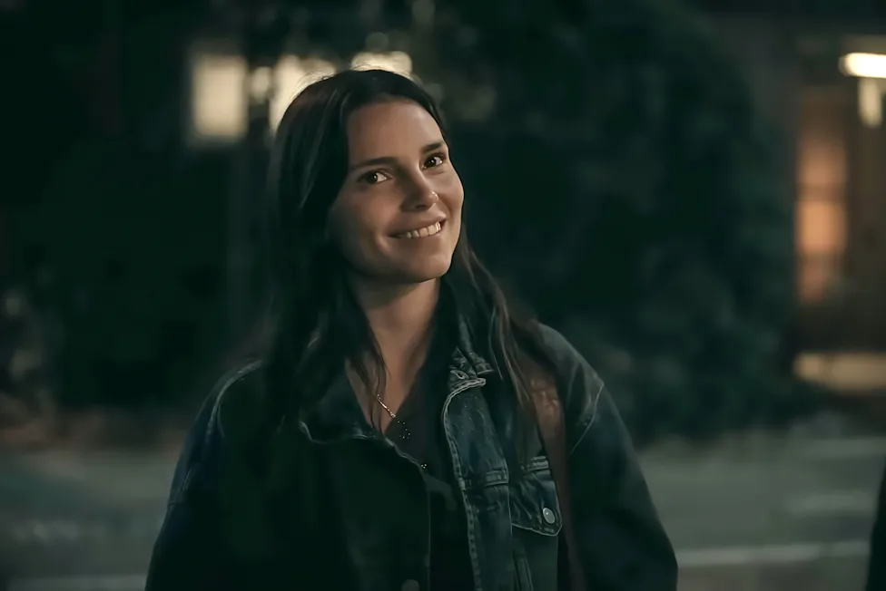 Nikki smiling warmly at night, before the wish transforms her