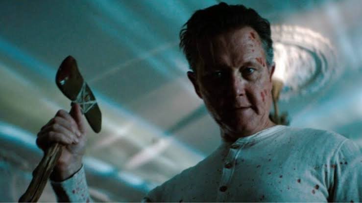 Josiah holding a bloodied hatchet in What Josiah Saw