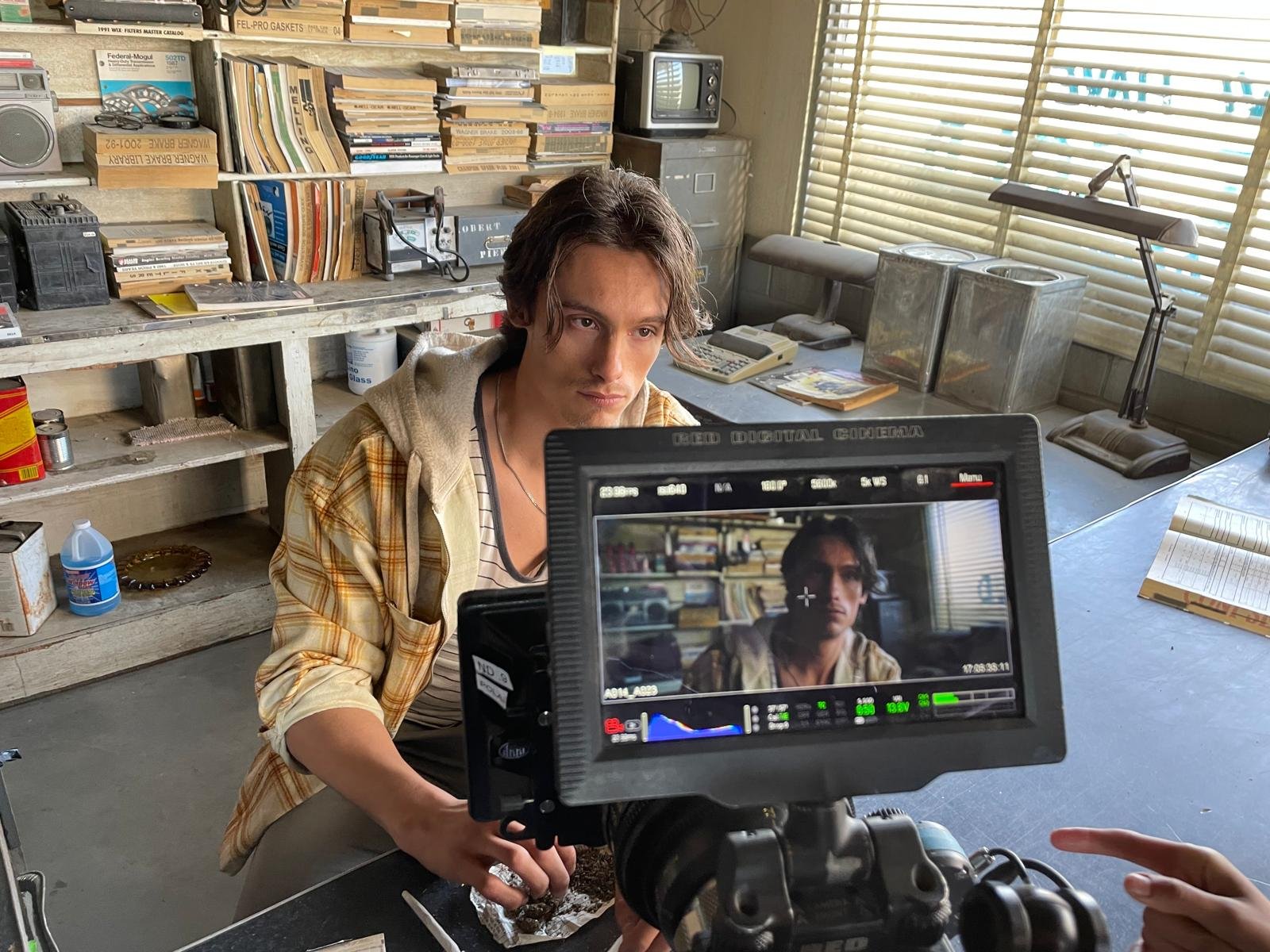 Felix Merback as Blake at the gas station counter in Blood Star