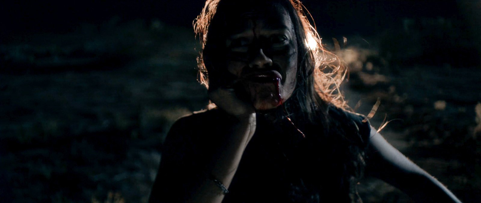 A bloodied Bobbie in the desert at night in Blood Star