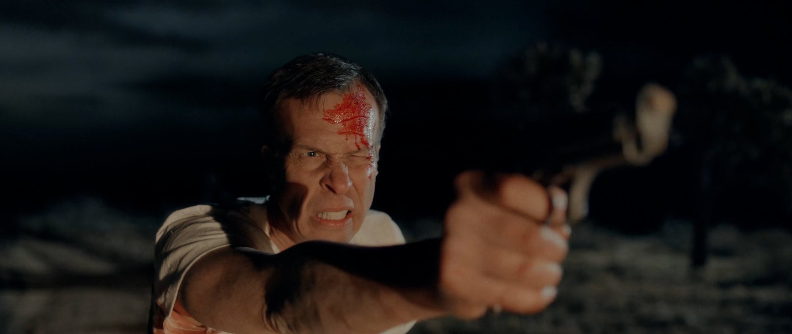 Sheriff Bilstein with a gun in the desert in Blood Star