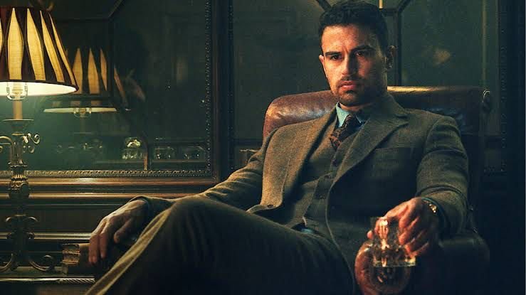 Eddie Horniman seated in an armchair echoing The Godfather in The Gentlemen