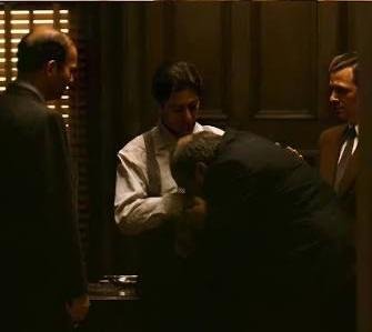 A tense negotiation scene in The Godfather