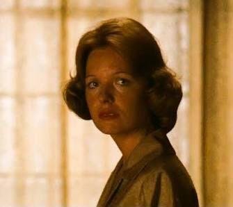 Kay Adams-Corleone looking out a window in The Godfather Part II